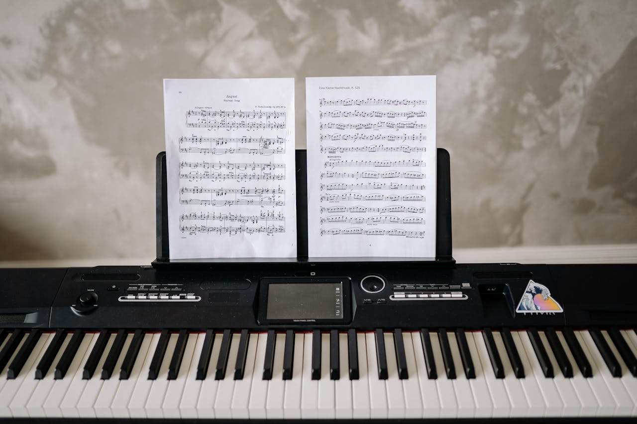 An electronic keyboard with sheet music displayed, ideal for modern music practice.